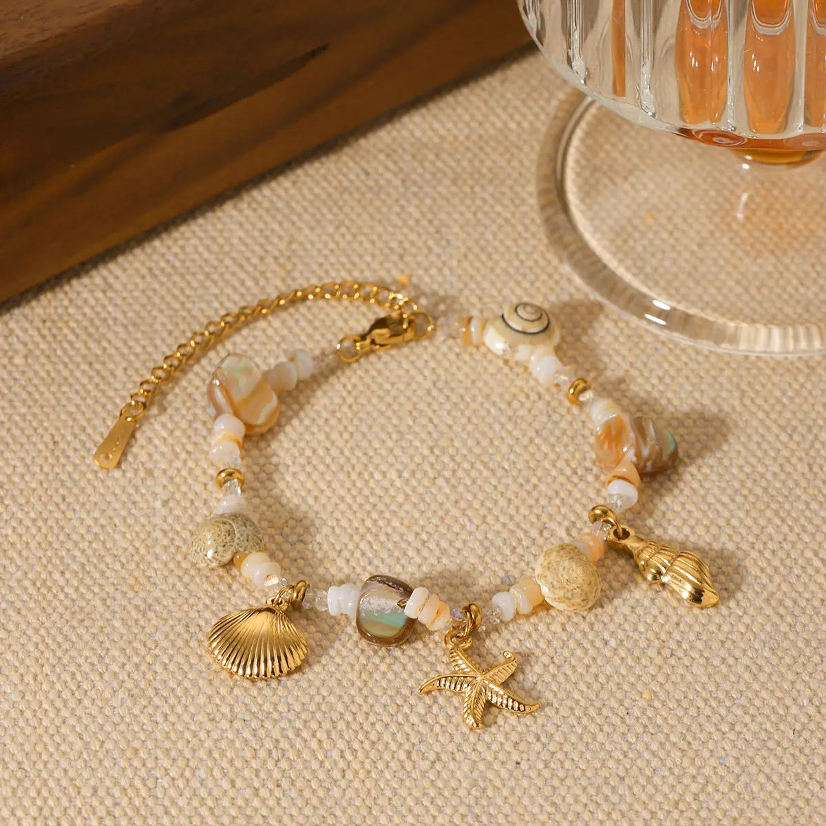Pulsera de acero inoxidable con estrella de mar y concha - image 1